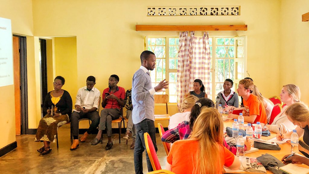 Students listening to speaker in Rwanda.