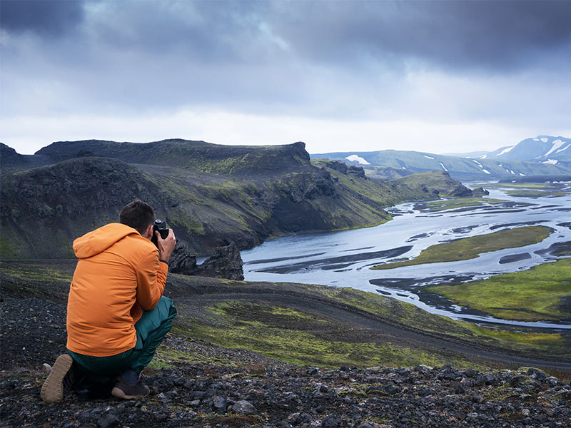Student taking a photo in Iceland